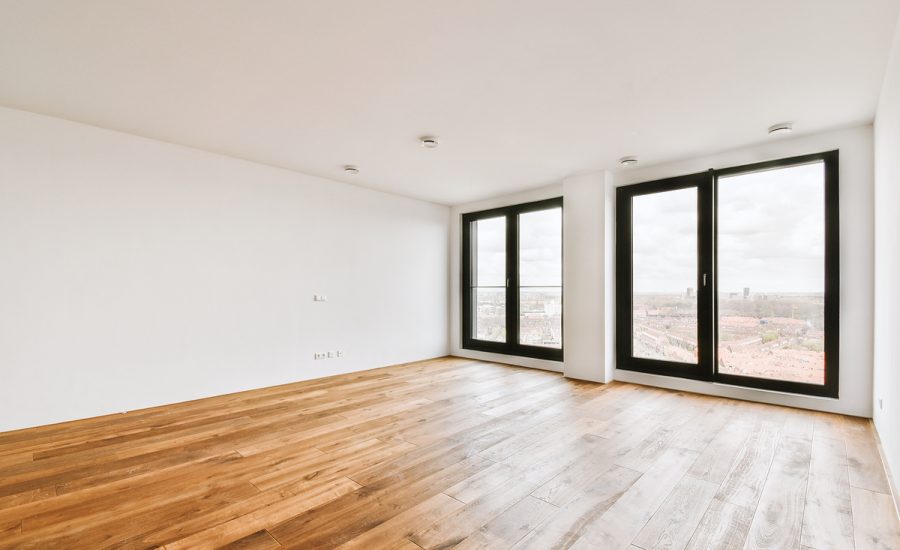 Plastic window and white wall in empty light room at home