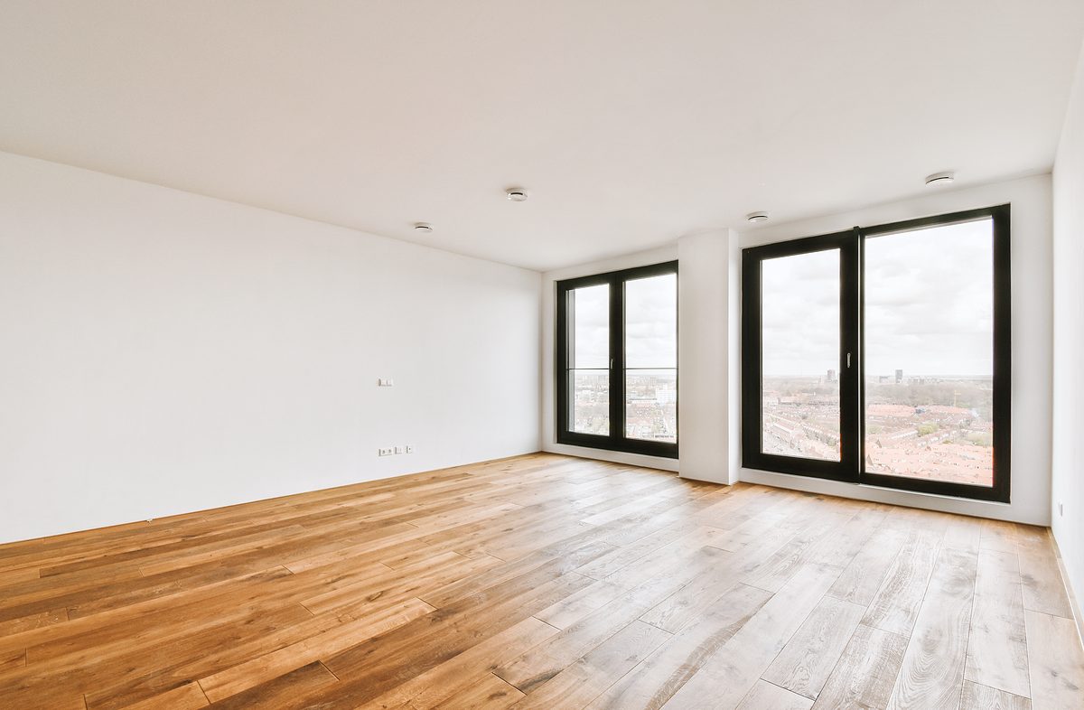 Plastic window and white wall in empty light room at home