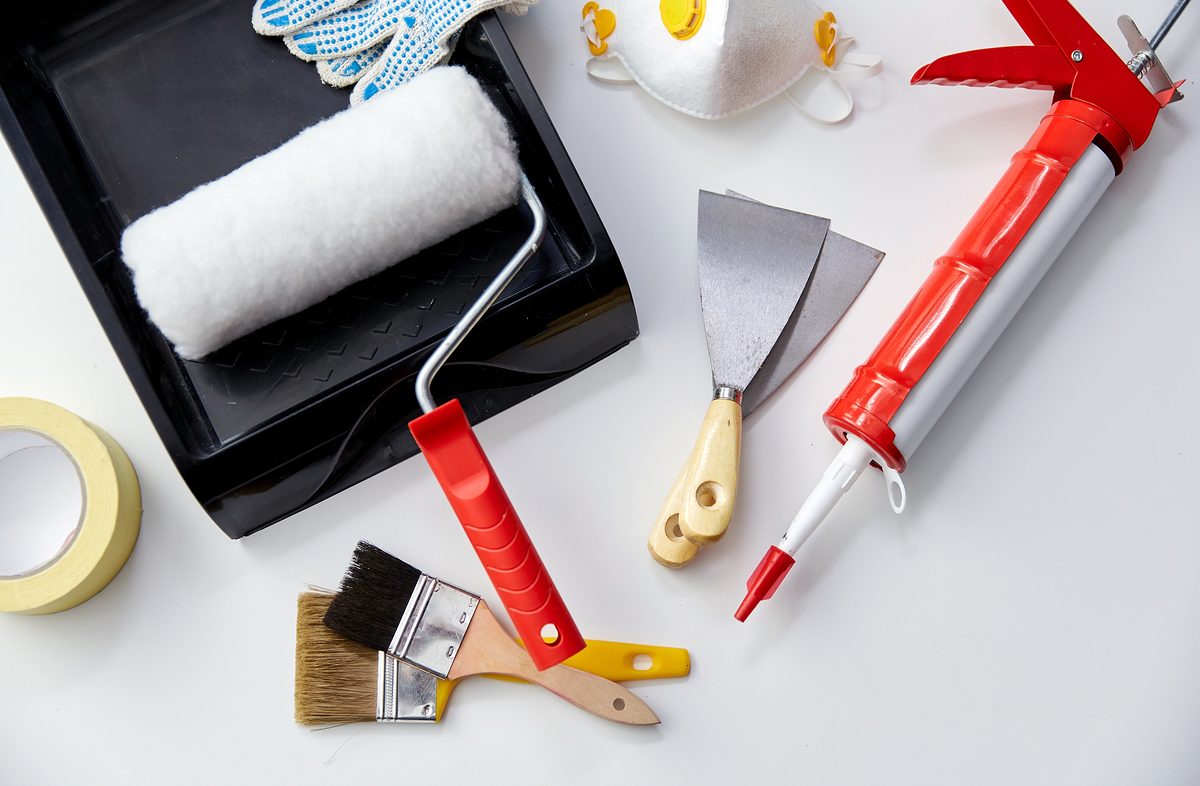 repair, building and renovation concept - different painting work tools on white background