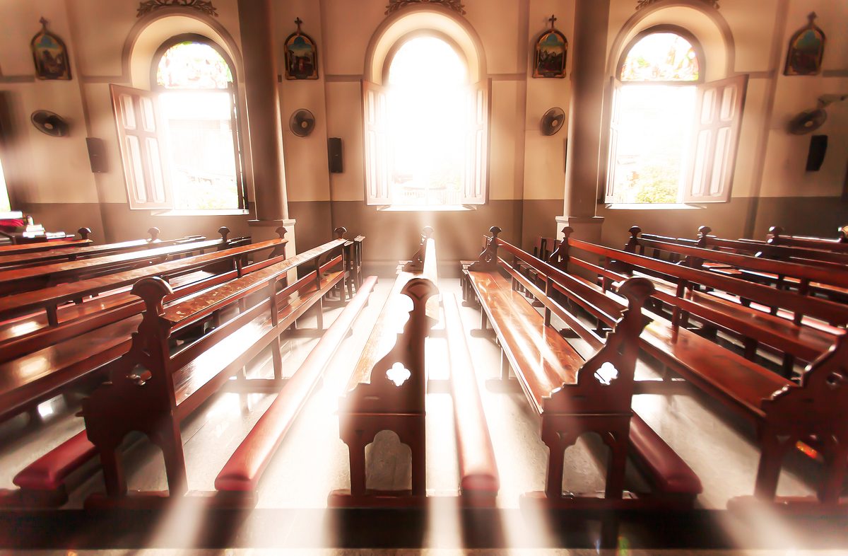 Tranquil ancient church interior at sunrise, Santa Cruz Church or Kudi Chin, Bangkok, Thailand. The church is open to the public. High-key lighting. Defocus.